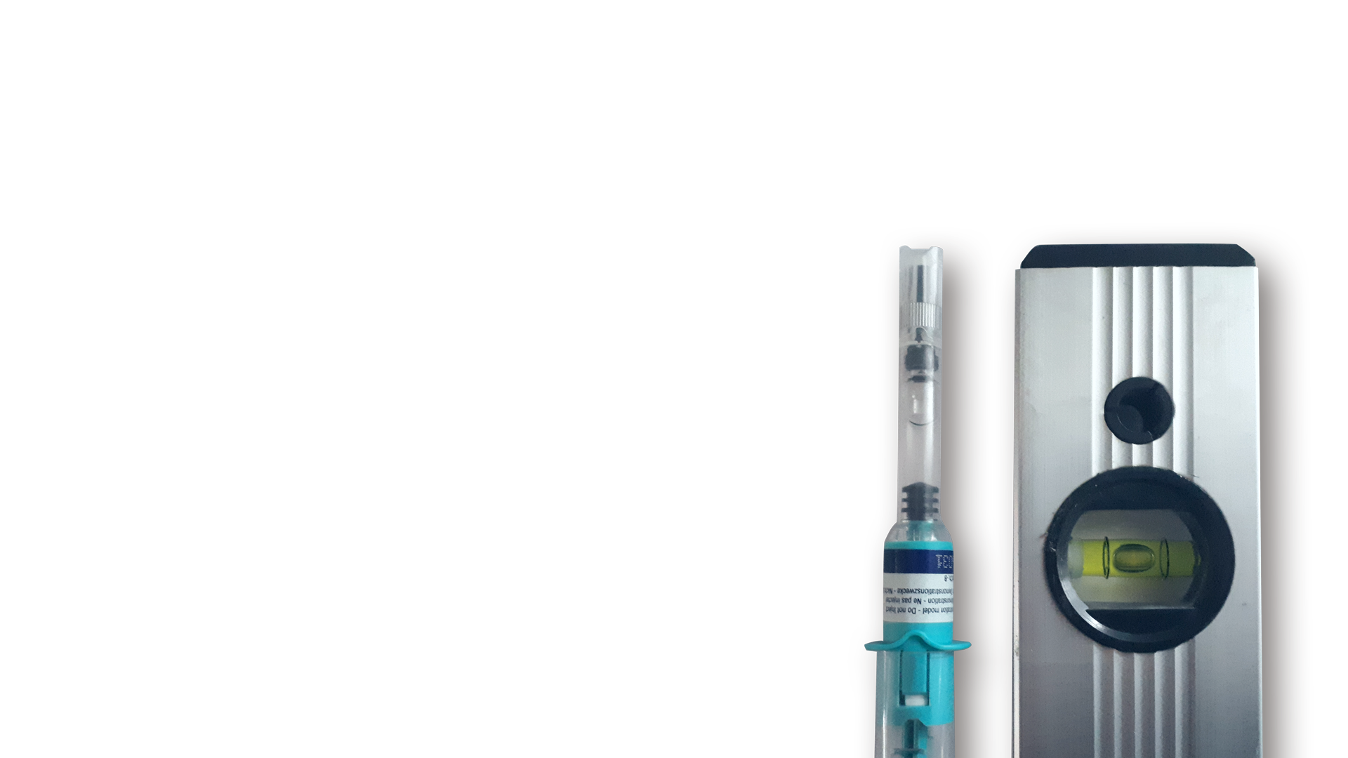 Spritze Wasserwaage rechts unten vor transparentem Hintergrund